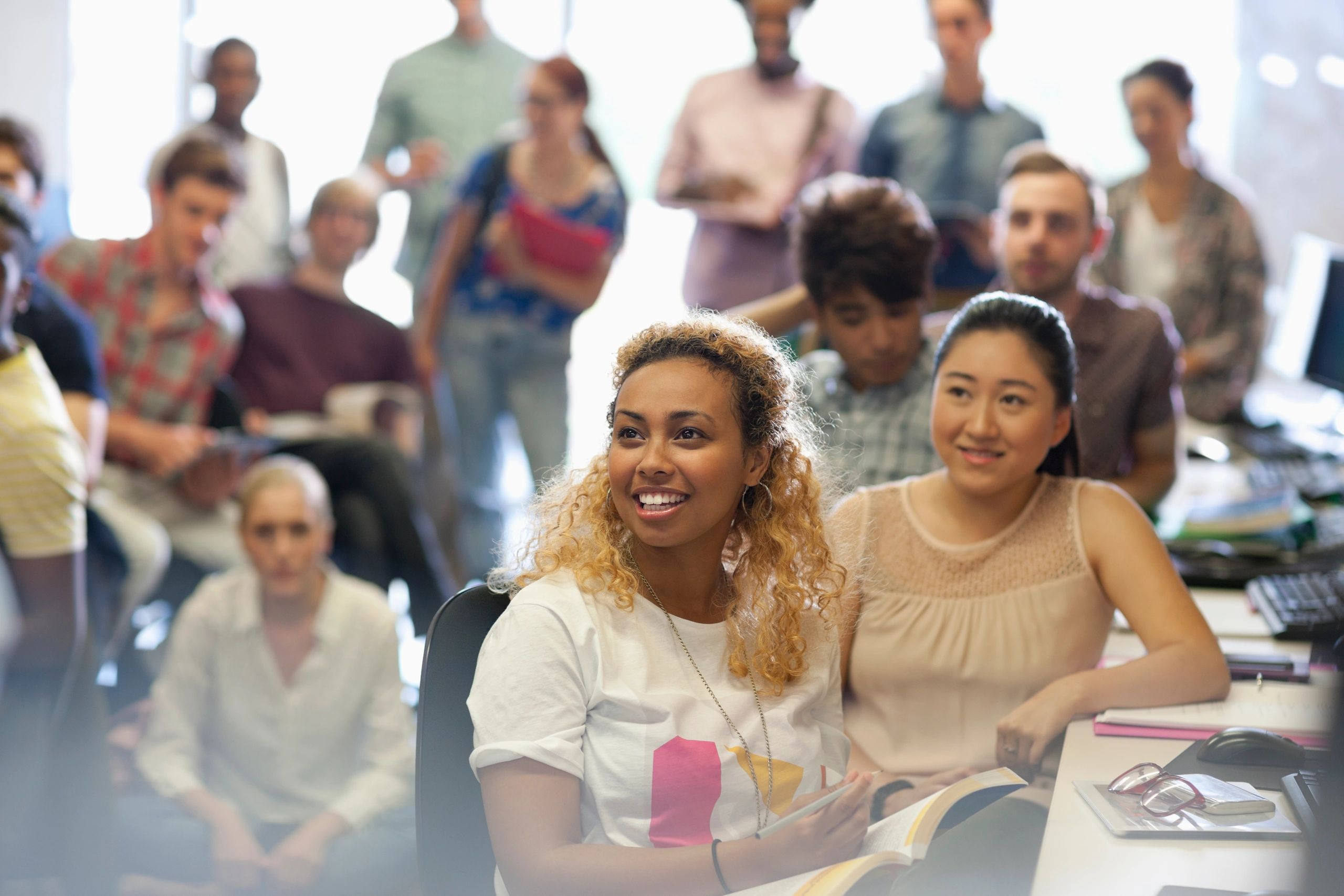 People attending a seminar in a classroom setting